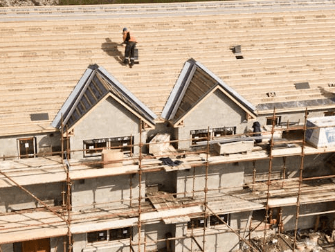 Construction site showing houses under renovation